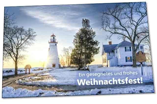 Weihnachtskarte: Leuchtturm neben alter Villa