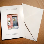 Faltkarte Jahreslosung 2026  „Verwitterte und renovierte Haustür“